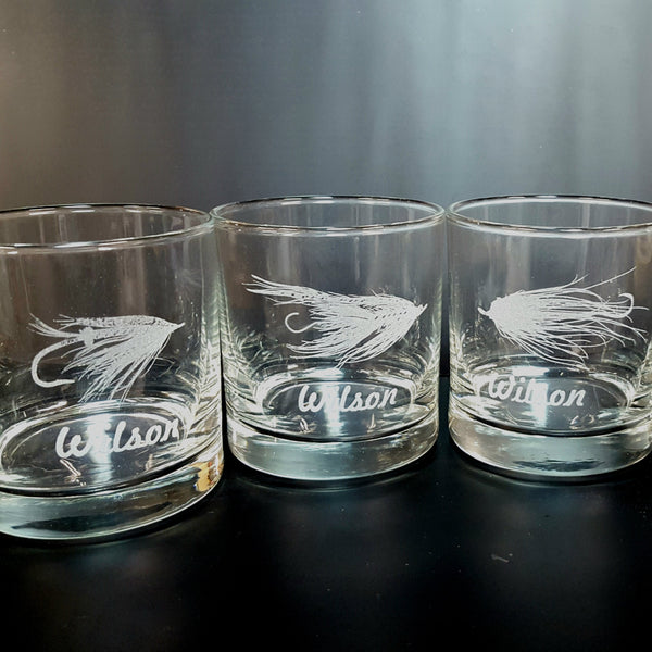 whiskey glasses with flies on them