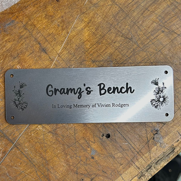 Acrylic bench plaque with custom engraved text. 